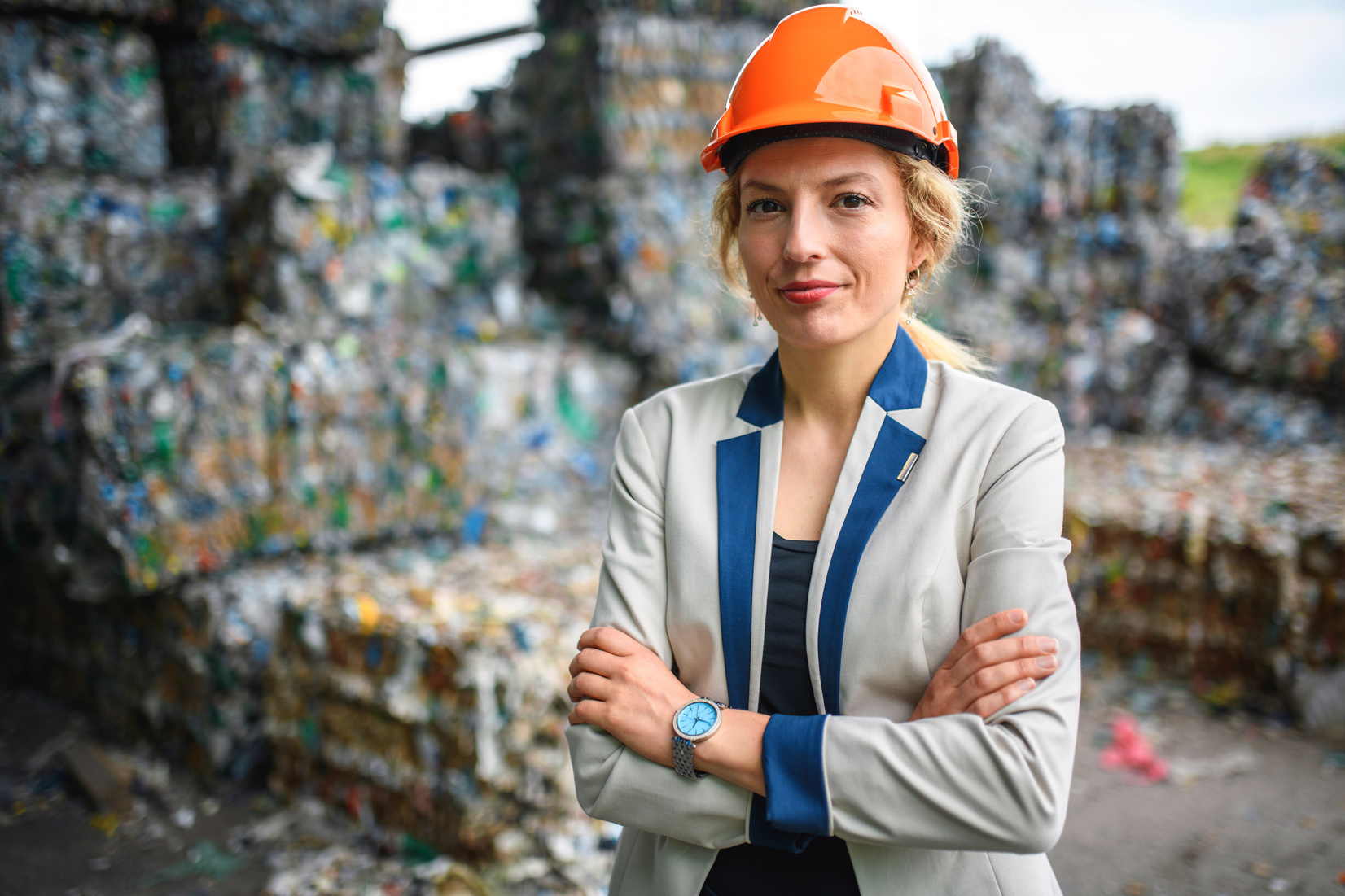 Confident Female Waste Management Expert Working Outdoors